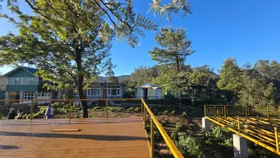 a view of the building from the parking lot at Silver lake nature escape in Ooty