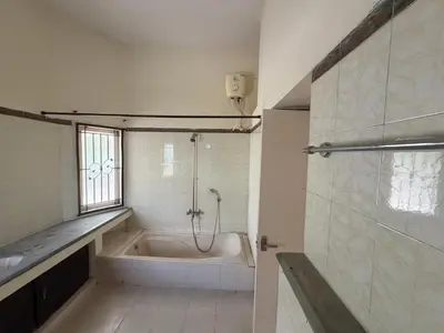 a bathroom with a bath tub and a shower at Didan Stays in Coimbatore
