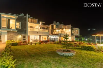 a large building with a yard in front of it at night at EKOSTAY - Echo Villa in Kodaikānāl