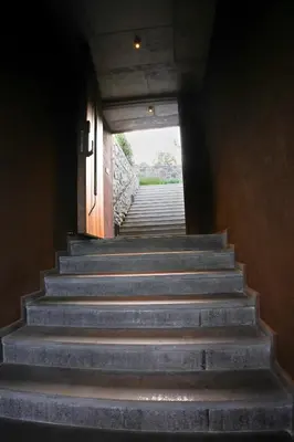 a stairway leading up to a building with a stair case at Ayana Villa By KPM in Varagampadi