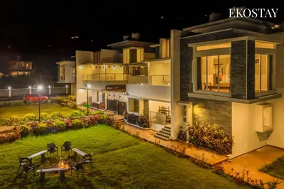 an aerial view of a house at night at EKOSTAY - Helios Villa in Kodaikānāl