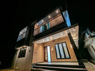 a house is lit up at night at Nana's Residency in Ernakulam