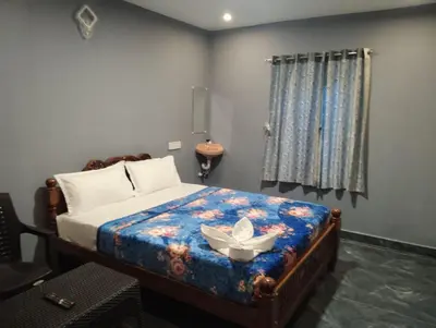 a bedroom with a bed with a bowl on it at Msk indian Residency in Kodaikānāl