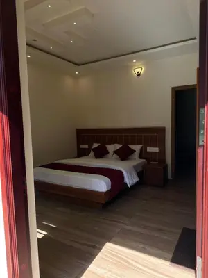 a bedroom with a large bed in a room at Honeymoon holidays in Vythiri