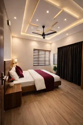 a bedroom with a large bed with a ceiling at Honeymoon holidays in Vythiri
