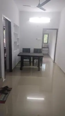 a bench sitting in a room with a ceiling at Aswathy Bhavan in Vadakkāncheri