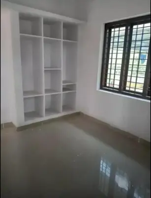 an empty room with a window and a room with water at Aswathy Bhavan in Vadakkāncheri