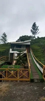 a house with a staircase leading up to it at Bison valley in Ooty