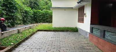 a brick walkway in front of a house at Valley De Hills Villa Room in Attappādi