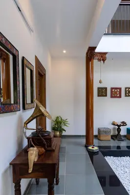 a room with a table with a lamp on it at 1st Miracle By Mirth, Mythadi , Coorg in Ammatti