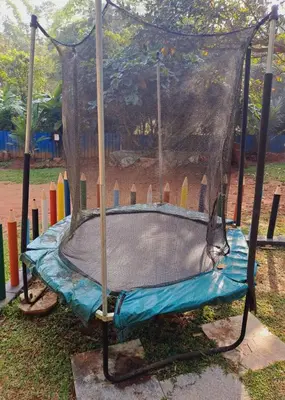 a trampoline in a park with at Karlad Lake Resort in Wayanad