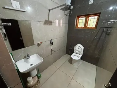 a bathroom with a sink and a toilet at 3 bhk Premium home Stay at Ernakulam Aluva Perfect for Family and Long stay in Alwaye