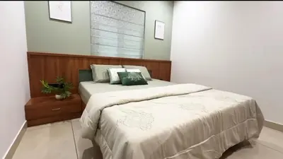 a bedroom with two beds with white sheets at Couple friendly apartment in Kozhikode