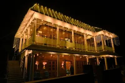 a house with christmas lights on it at night at Eden Spot in Marayoor
