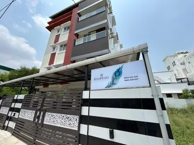 a building with a sign in front of it at Krish homes in Coimbatore