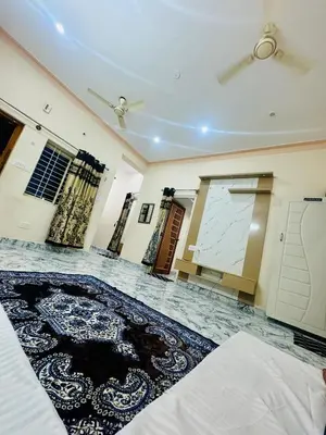 a room with a rug on the floor and a ceiling at Flats in CITY Centre Next to Nexus Mall, 1km from bus stand in Mysore