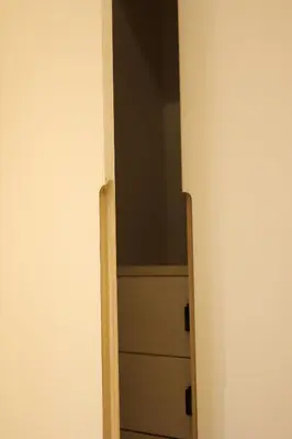 an open door to a closet in a room at Nilgiri Breeze Apartment in Pīlamedu