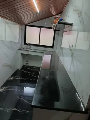 a bathroom with a glass counter and a sink at Ananya Homestay in Napoklu