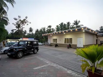 a jeep parked in a parking lot in front of a building at Royal Residency in Coimbatore