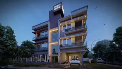 a tall building with a sign on top of it at Twilight Residency in Kizhake Chālakudi