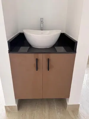 a bathroom with a white sink on a counter at Twilight Residency in Kizhake Chālakudi