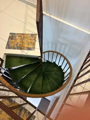 a chair with a large green leaf on a glass floor at Bethel resorts in Kanthalloor