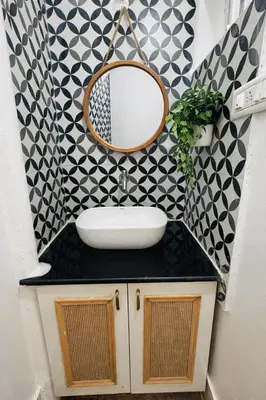 a bathroom with a sink and a mirror at Nele Mane in Mysore