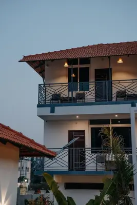 a view of a building with balconies at Fenna Resort And Spa, coorg in Kushālnagar