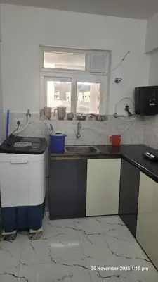a kitchen with a sink and a stove and a window at 1 BHK Luxury Flat in Samudhra Apartments-105 in Guruvāyūr