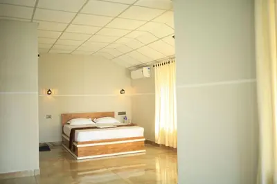 a bedroom with a bed in a room at Kghomestay in Pallipuram