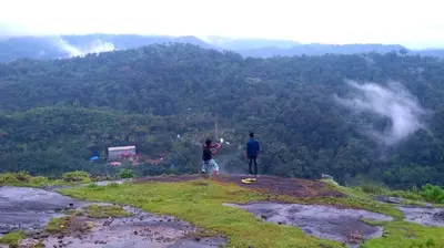 two people standing on the top of a mountain at Skyfall Villa in Chillithodu