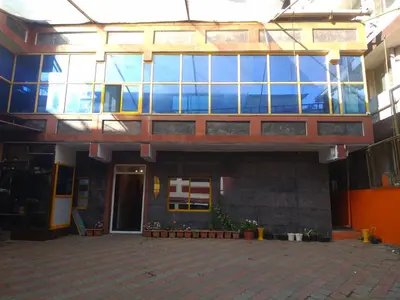 a building with a lot of windows on it at Pillars residency in Ooty