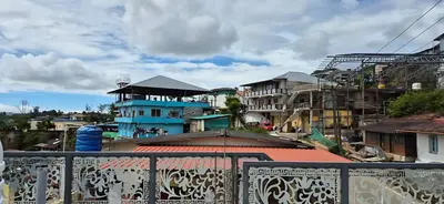 a view of a city with buildings in the background at Stay41 in Vālpārai