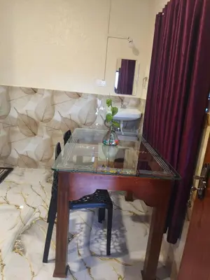 a glass table with a plant sitting on top of it at Brigmonsiya in Vattavada