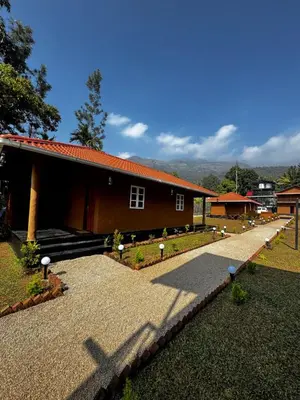 a house with a pathway in front of it at Marayoor Mud Castle in Marayoor