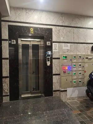 a elevator in a subway station with a ticket machine at Royal Stay Mysuru Service Apartment in Mysore