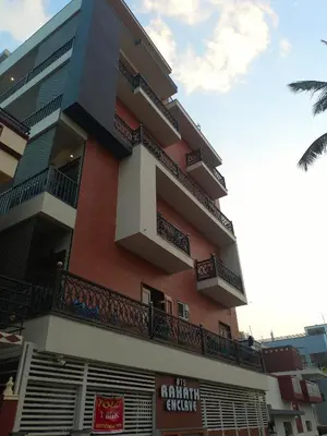 a building with balconies on the side of it at Royal Stay Mysuru Service Apartment in Mysore