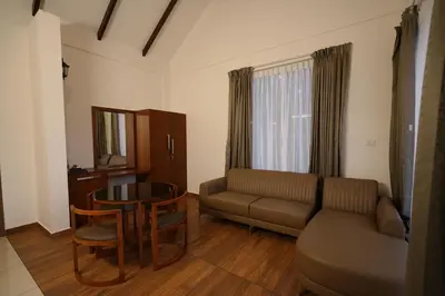 a living room with a couch and a table at Mountain Vista Resorts LLP