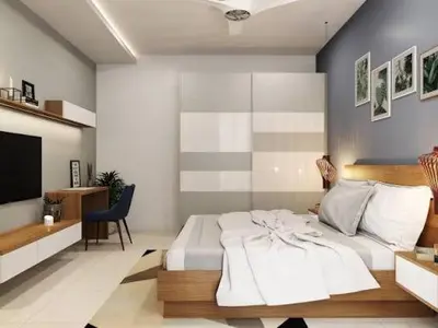 a bedroom with a large white bed and a tv at Star Homestay in Vālpārai