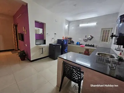 a kitchen with a sink and a counter top at SHI's Krishna 2BHK Villa Furnished Cozy Stay in Coimbatore