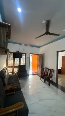 a living room with couches and chairs and a ceiling at The Elephant watch in Viripara