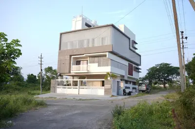 a large building on the side of a road at The Residence 267 Home Stay in Mysore