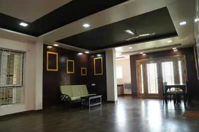 a living room with a couch and a table at Luxury Stays in Coimbatore