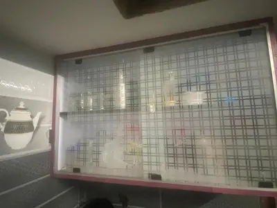 a glass window of a display in a store at PK Homestay in Coimbatore