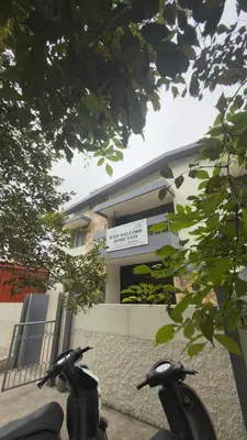 two motorcycles parked in front of a building at Roshan's Welcome Home Stay in Mysore