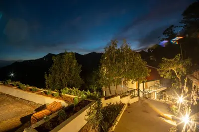 a view of a park at night at SaffronStays Valleyfall in Kotagiri