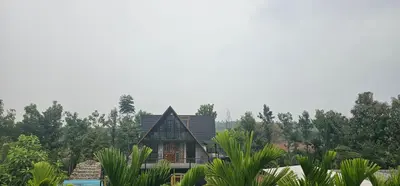 a house in the middle of a forest at Ambience Retreat in Sivasamudram