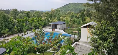 an overhead view of a swimming pool at a resort at Ambience Retreat in Sivasamudram