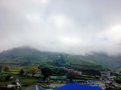 a view of a mountain in the clouds at Vattavada Homestay in Vattavada