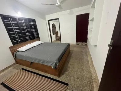 a bedroom with a bed in a room at VY3 Homes in Vythiri